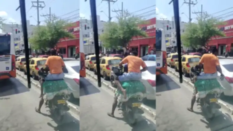 DATT sancionará a motociclista que circuló por carril de Transcaribe con pasajera sobre carga en Cartagena
