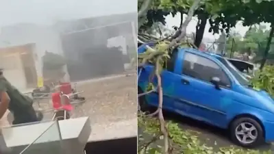 Ventarrón arrasa cafetería en Cali durante aguacero: mesas y sillas volaron por el aire