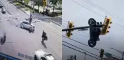 Grave accidente: moto queda colgando de un semáforo en Canadá y conductor sobrevive